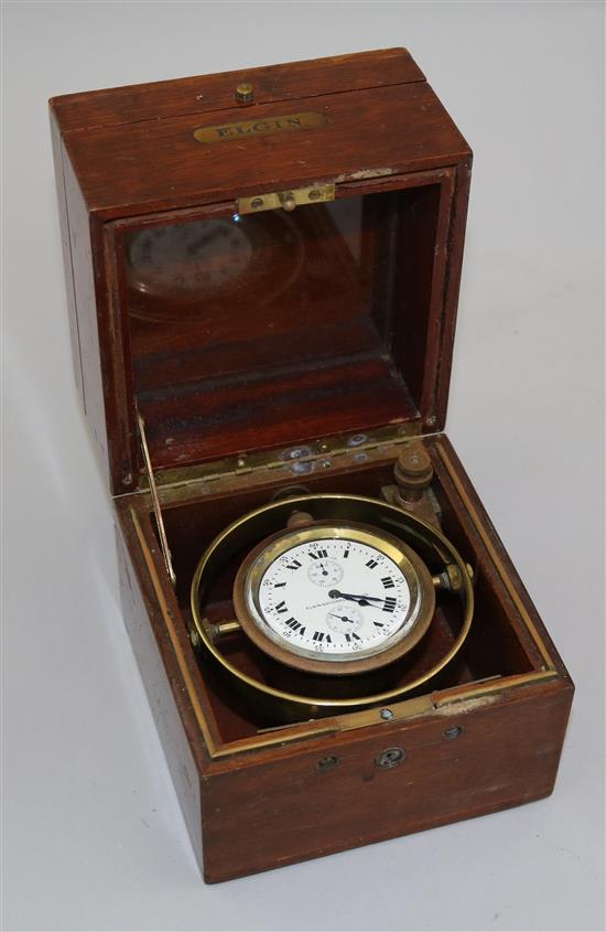 An Elgin National Watch Co teak cased brass deck watch, W.5.25in. H.5.5in.